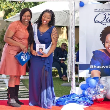 Lihle Zilwa Outdoor Book Launch Portrait with Signage"